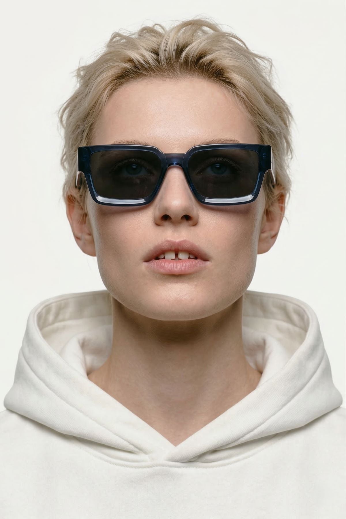 woman blue sunglasses plant based