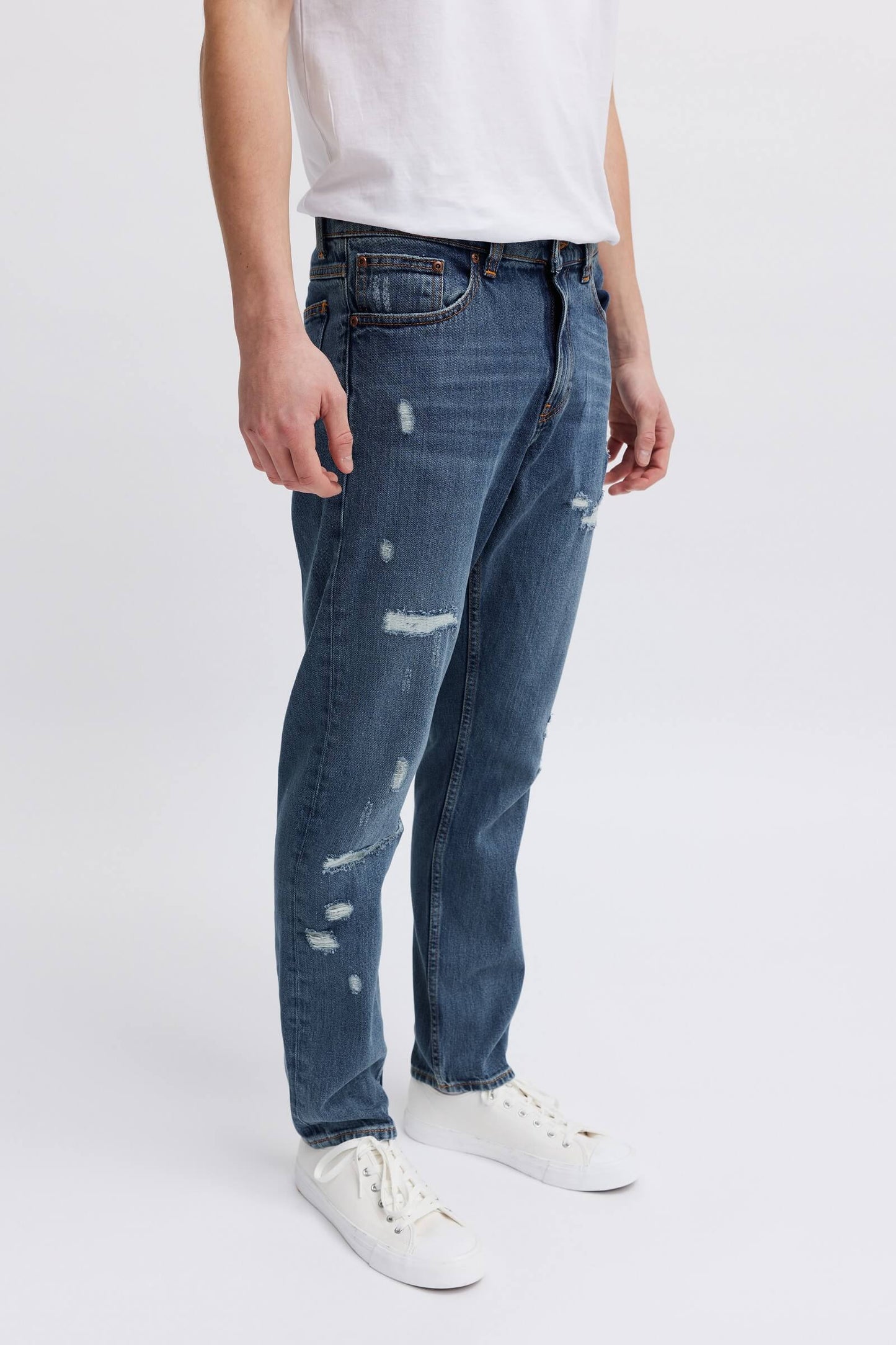 Recycled ripped jeans
