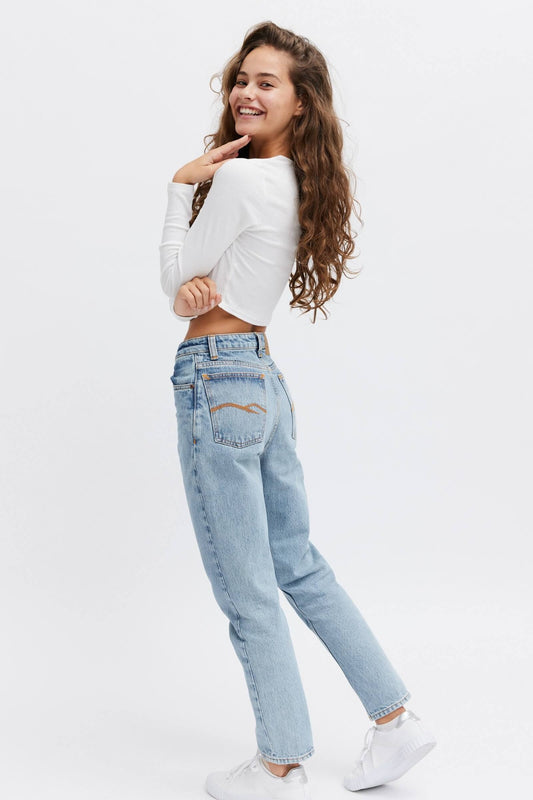 Trendy ethical female jeans. Light blue color