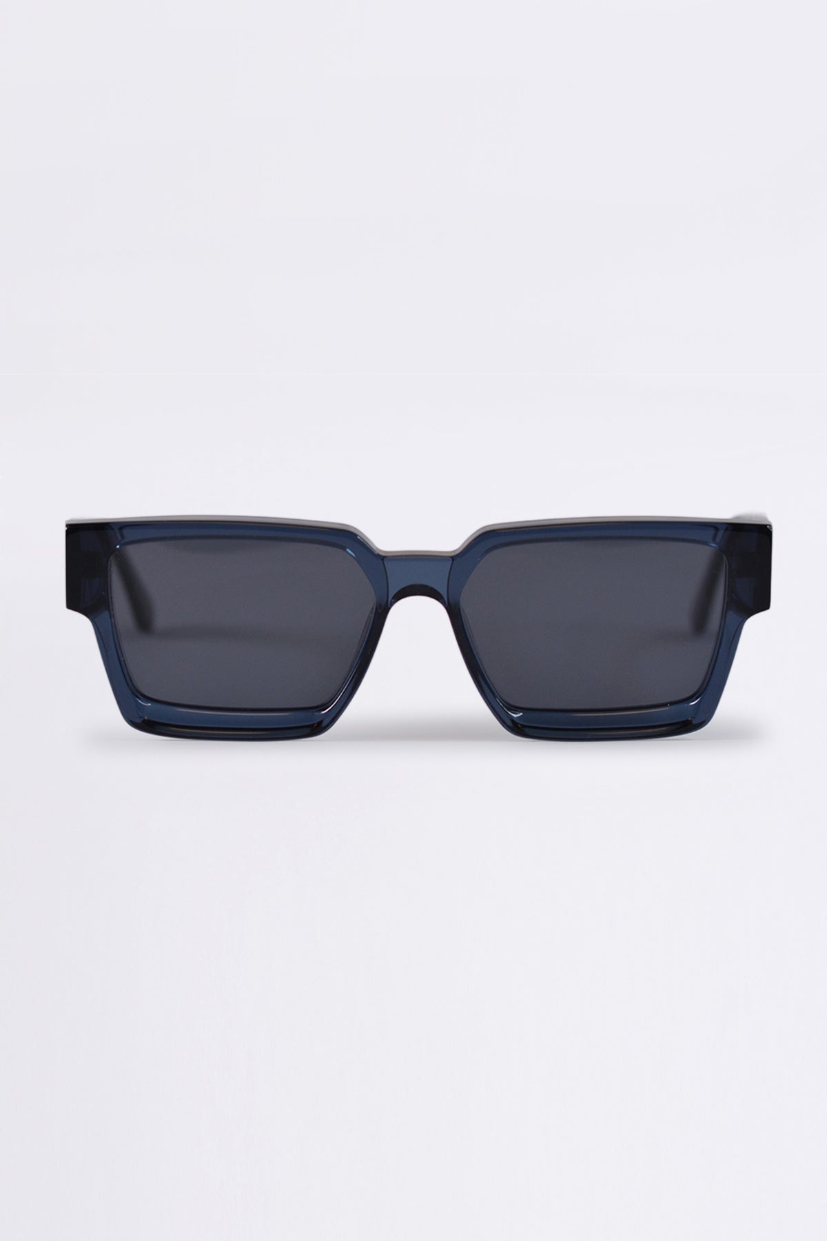 Sunglasses with a blue frame and dark lenses on a white background