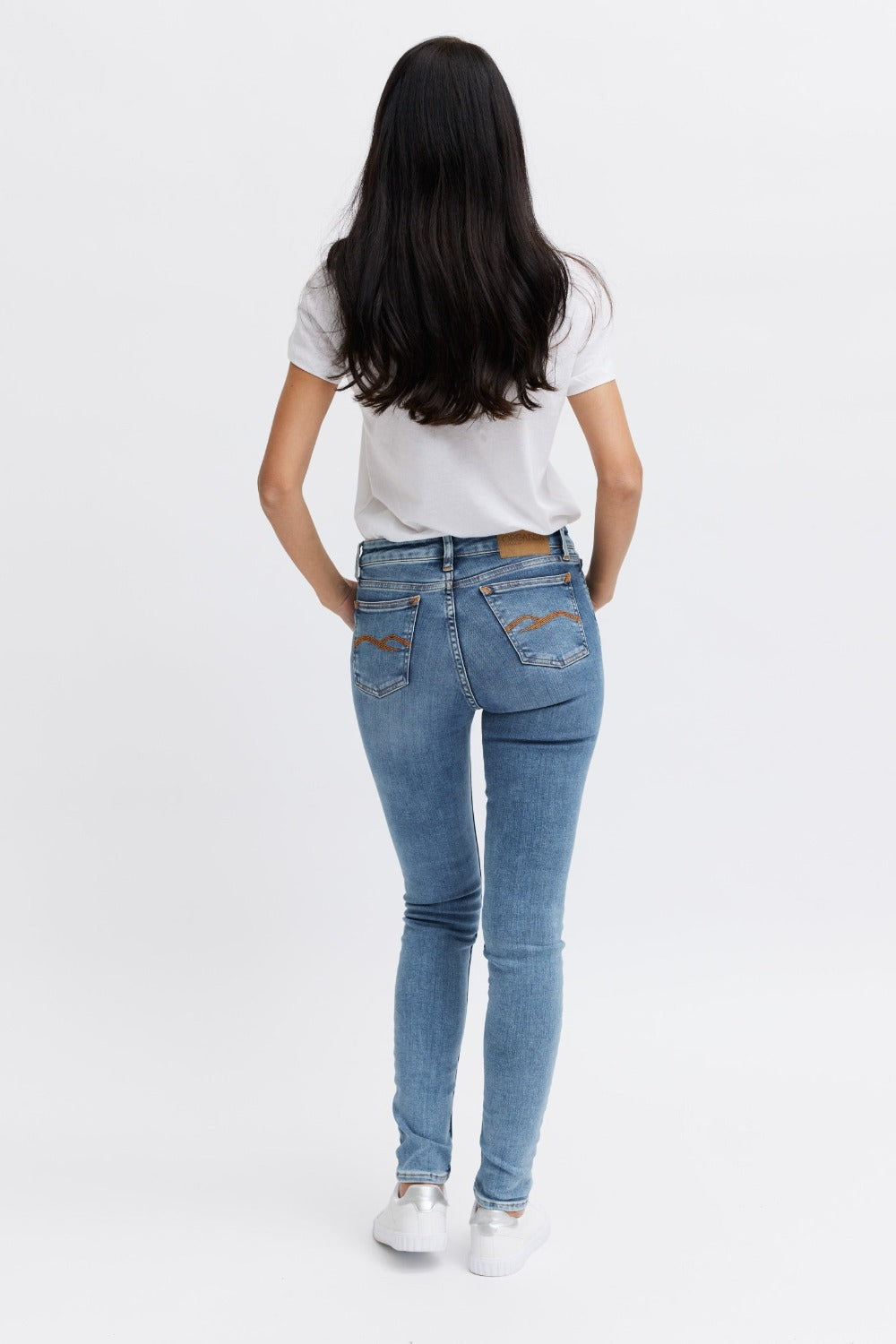 Form fitting women's jeans with orange detail - organic cotton