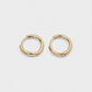 A pair of gold-toned, twisted hoop earrings shown on a plain light gray background.