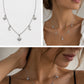 Silver celestial necklace with moon and star charms, shown on a model and as a flat product shot against a white background.