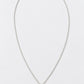 A delicate silver chain necklace with a small teardrop-shaped pendant featuring a white pearl-like center, displayed on a clean white background.