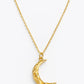 A gold chain necklace featuring a textured crescent moon pendant, displayed against a clean white background.
