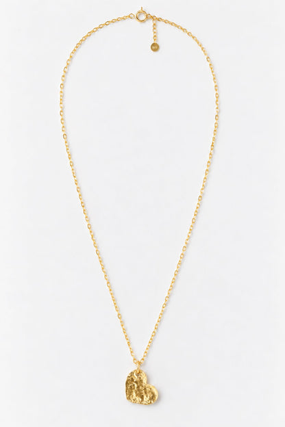 A delicate gold chain necklace featuring a small, textured gold heart-shaped pendant, displayed against a clean white background.