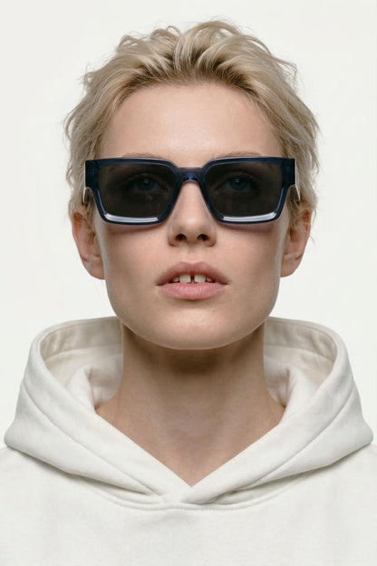 woman blue sunglasses plant based