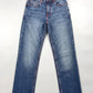 A pair of medium-wash blue denim jeans with contrast red stitching, laid flat against a light gray background.